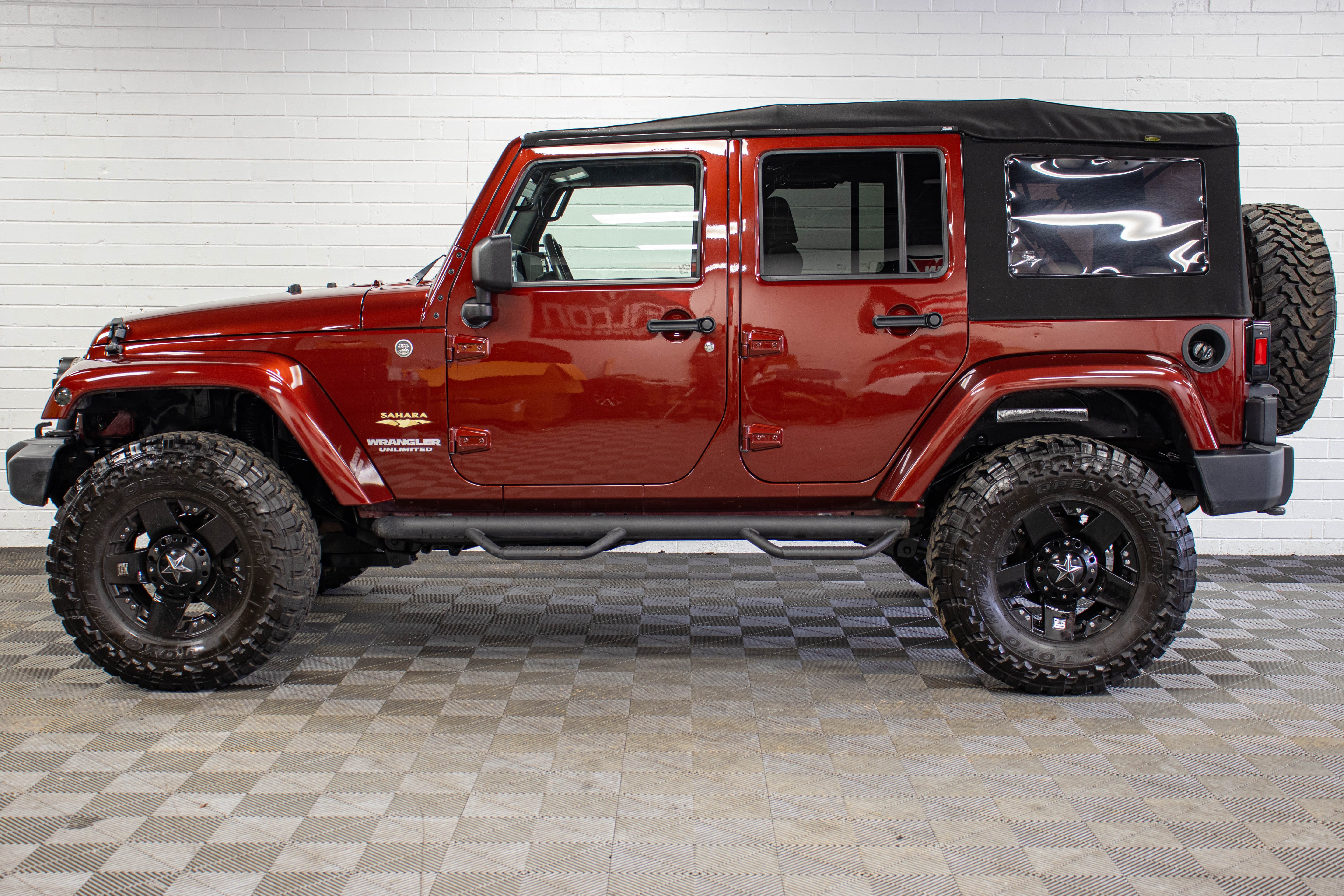 Pre-Owned 2009 Jeep Wrangler Unlimited Sahara Soft Top Red Rock - SOLD