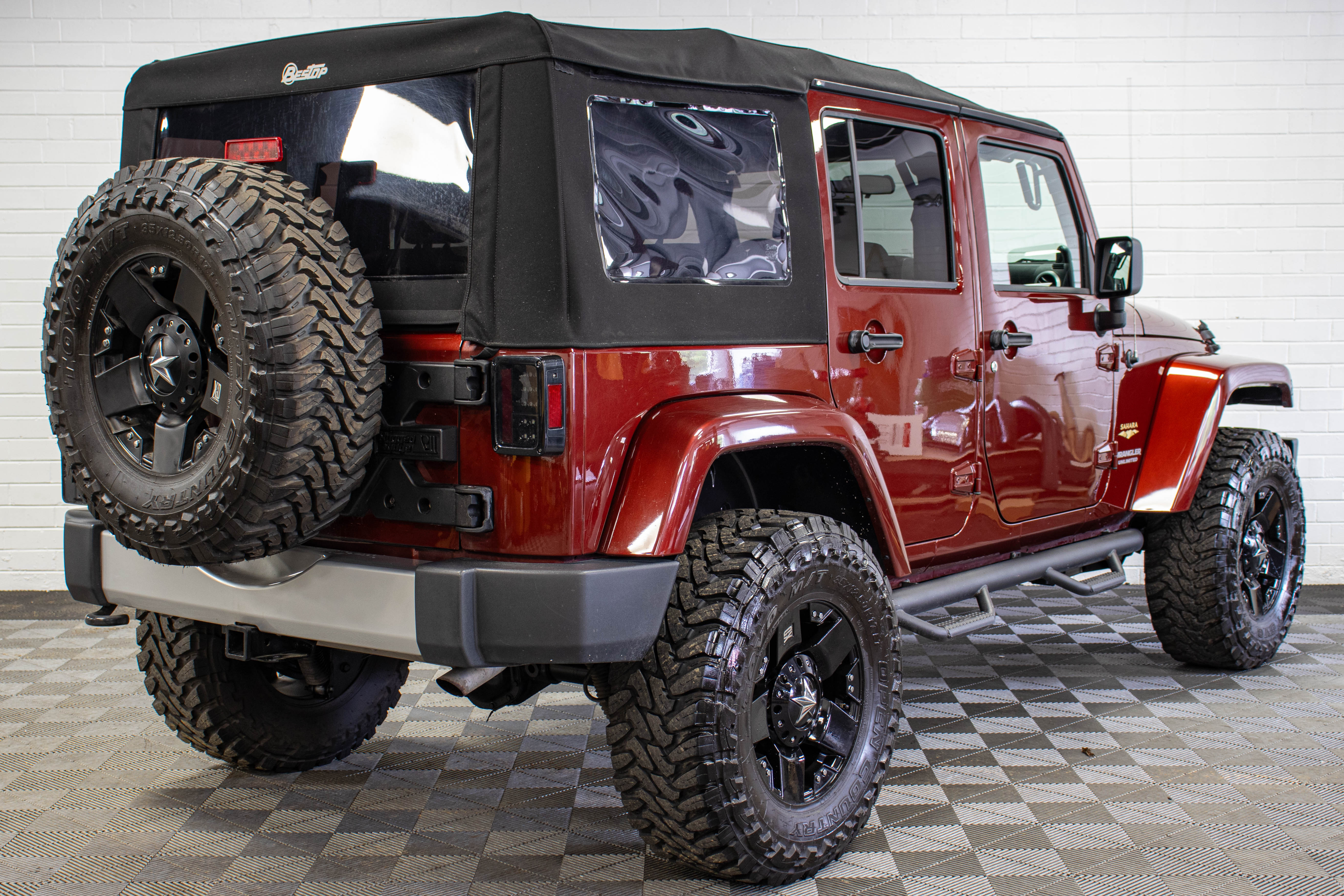 Pre-Owned 2009 Jeep Wrangler Unlimited Sahara Soft Top Red Rock - SOLD