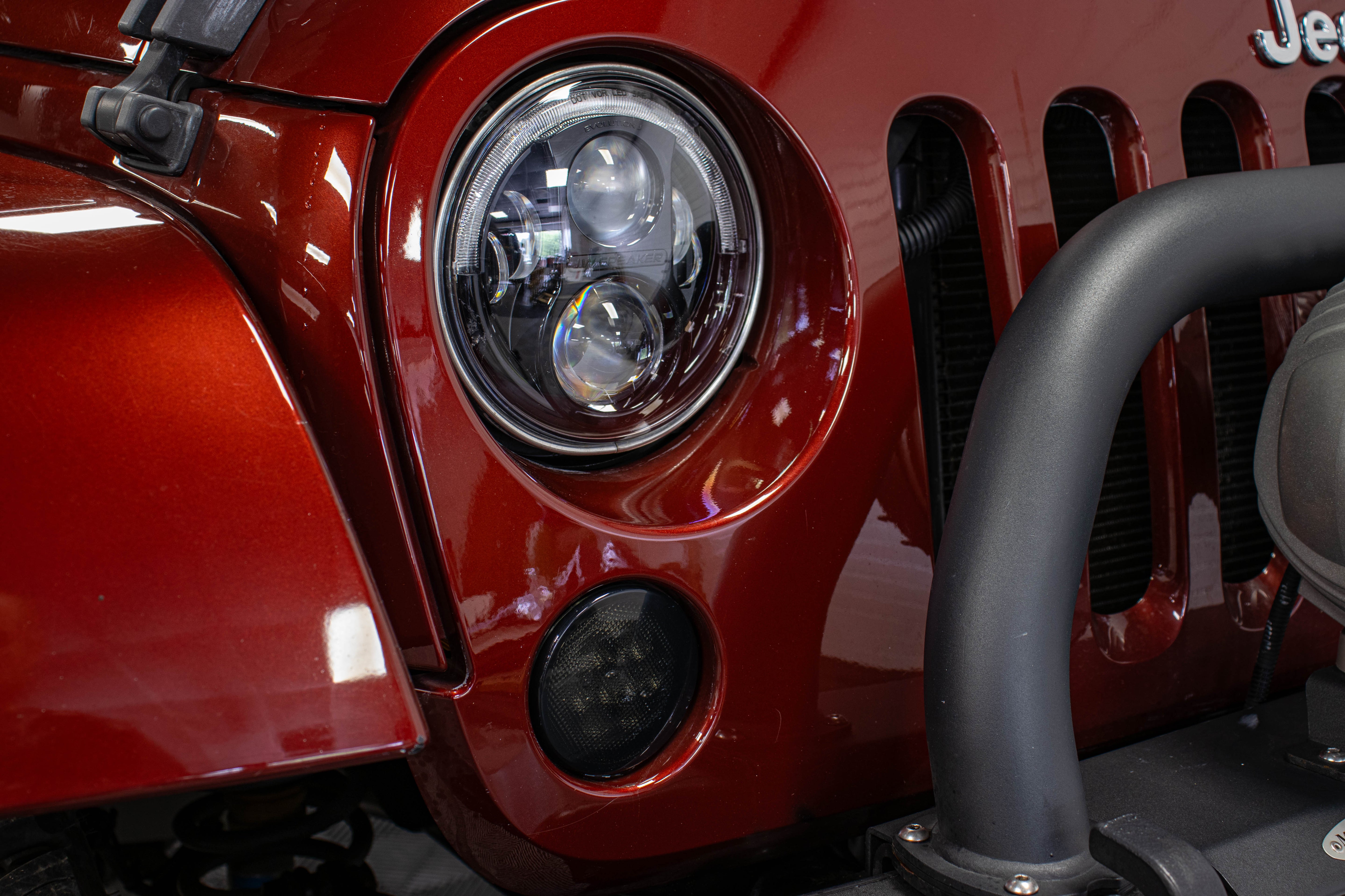 Pre-Owned 2009 Jeep Wrangler Unlimited Sahara Soft Top Red Rock - SOLD