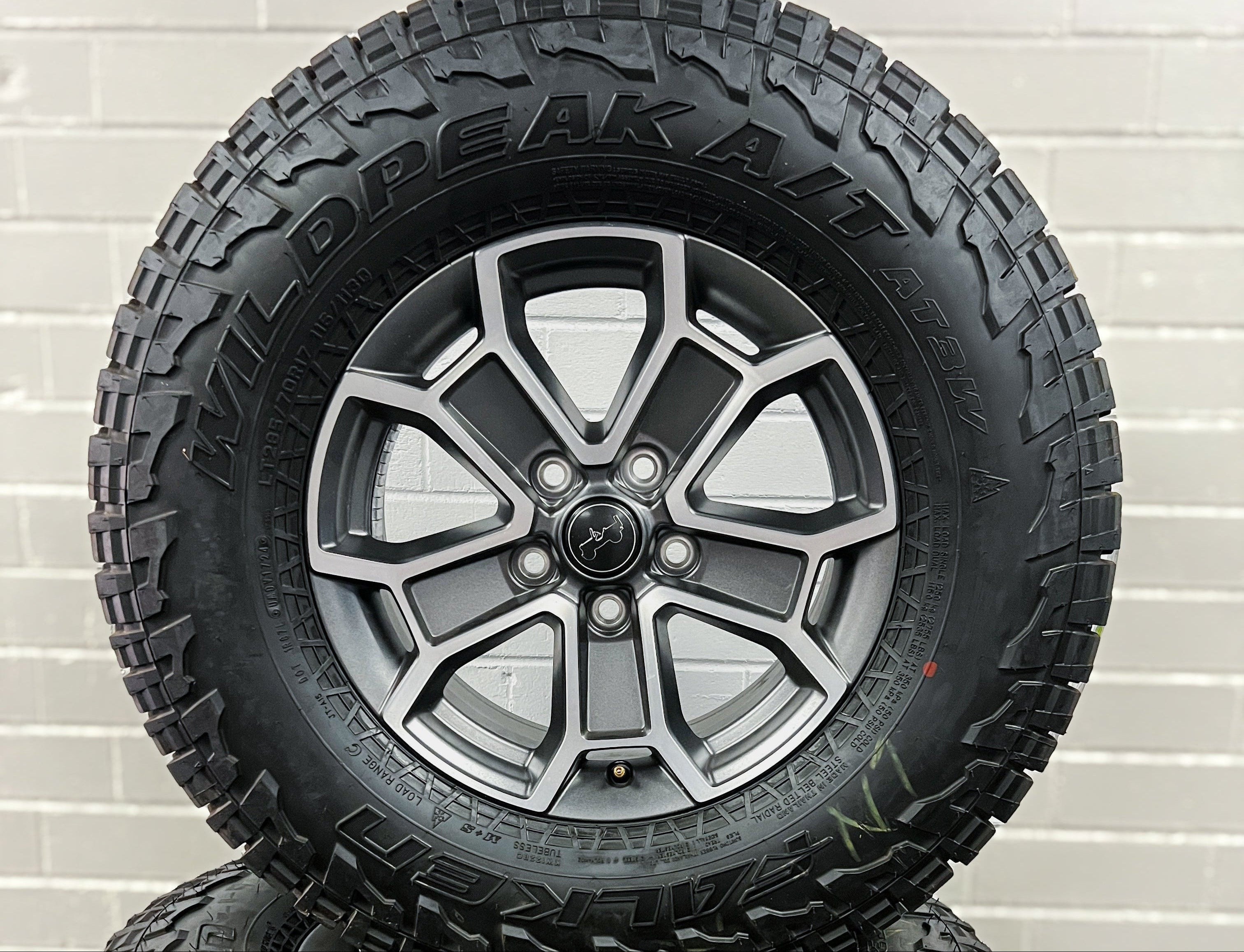 Gladiator Silver Face Black Wheels and Tires Falcon WildPeak AT3W Includes Steel spare