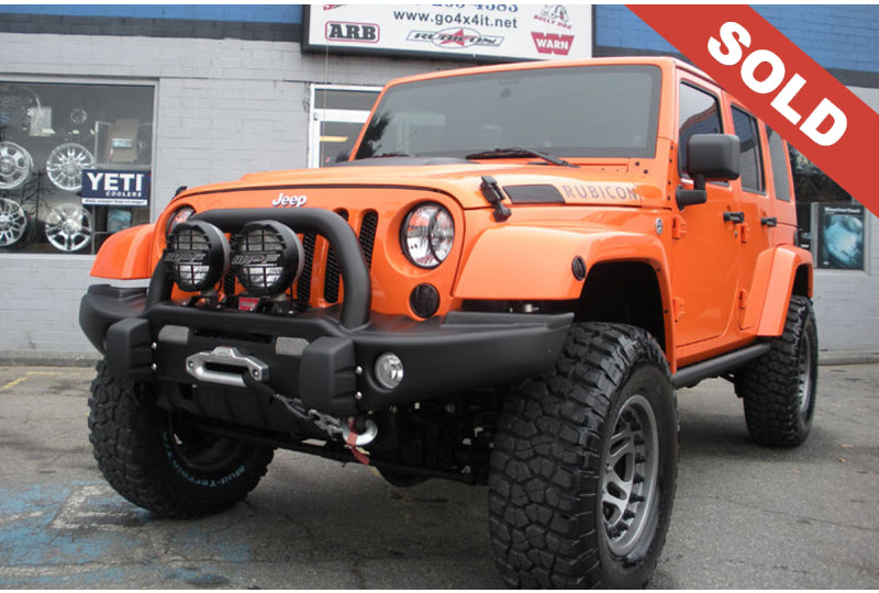 2012 Orange Jeep Wrangler Unlimited Rubicon - SOLD